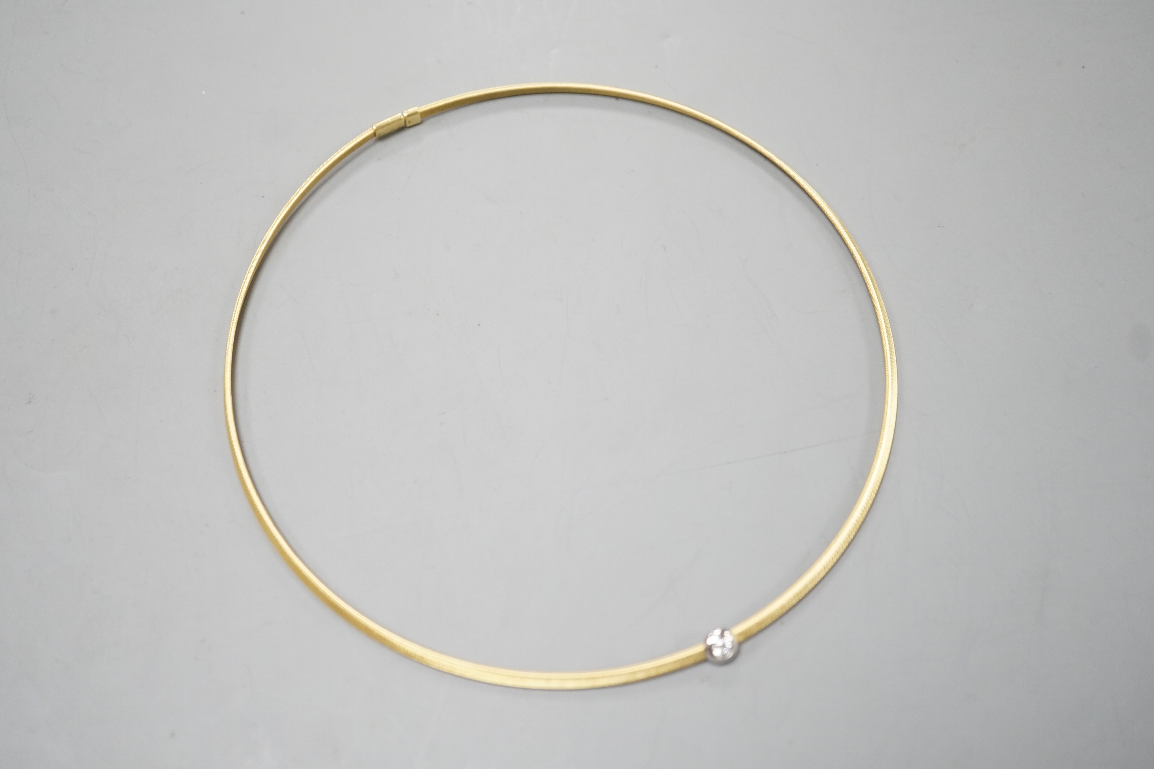 A modern 750 yellow metal and solitaire diamond set necklet, approx. 34-36cm, gross weight 8.2 grams.